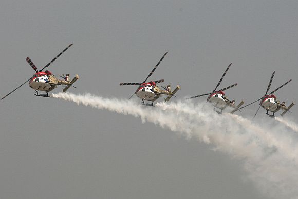 The Sarang helicopter team performs an aerobatic display.