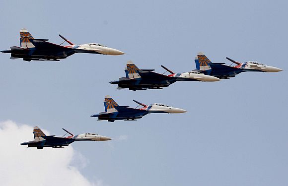 The Russian Knights aerobatic team in formation at the air show.