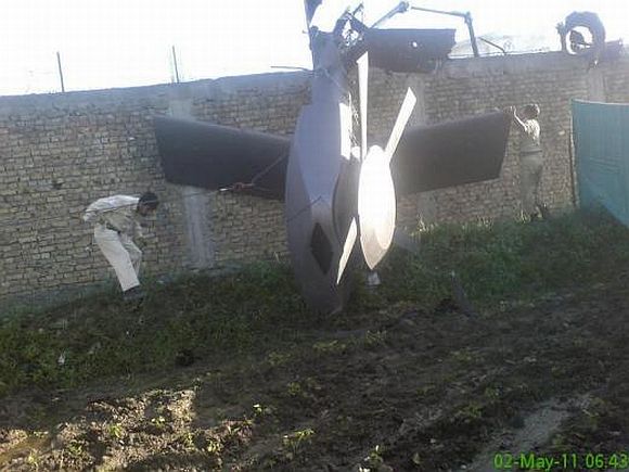 Part of a damaged helicopter lying near the compound after US Navy SEAL commandos killed Osama bin Laden in Abbottabad