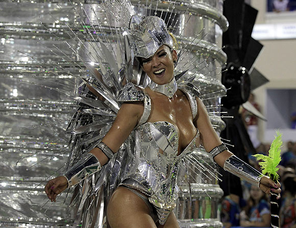 A reveller from  Grande Rio samba school participates during the annual Carnival parade in Rio de Janeiro's Sambadrome, February 12
