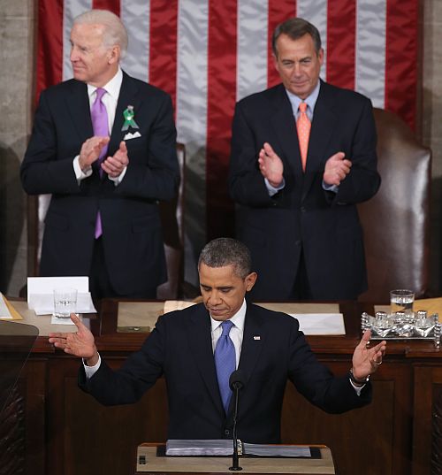 Flanked by US Vice President Joe Biden (Left) and Speaker of the House John Boehner (R-OH) (Right), Barack Obama delivers his State of the Union speech