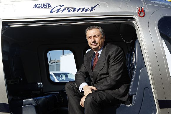 Former Finmeccanica Chairman and Chief Executive Officer Giuseppe Orsi poses in a helicopter