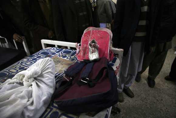 Schoolbags and a shoes are seen of a girl who was killed in the bomb attack