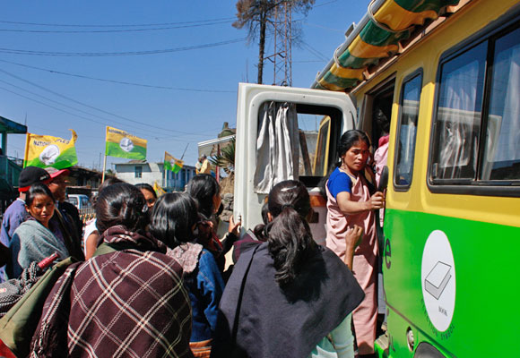 Women take a look into the unsual campaign van in the state.