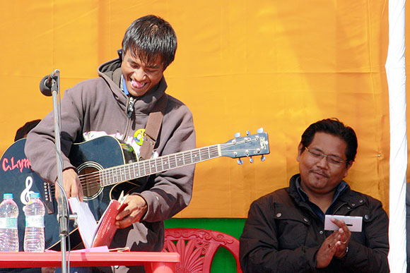 A local musician sings a Khasi song at Conrad Sangma's campaign meeting.