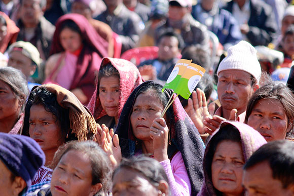 People listen to the many speeches at the meeting in Mawkyrwat, which is a rocky region.