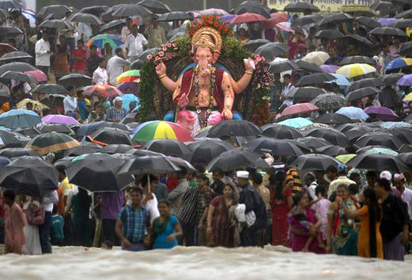 Hundreds gather at a religious immersion in Mumbai