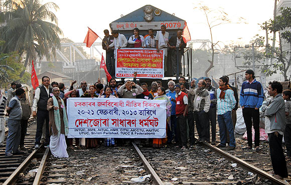 Protestors block the railway track at Guwahati