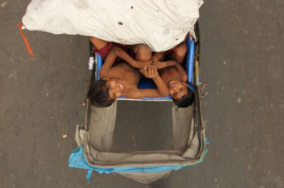 Mehrota says his image 'Over the top' captures two boys sitting on their father's rickshaw. Chhath festival is celebrated in Bihar and Uttar Pradesh, two of the most populous and poorest states of the country, and now in New Delhi, the county's capital, by the large migrant population.