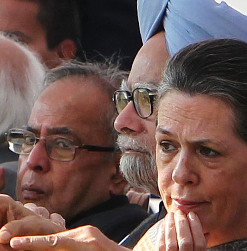 Prime Minister Manmohan Singh with then defence minister Pranab Mukherjee and Congress President Sonia Gandhi