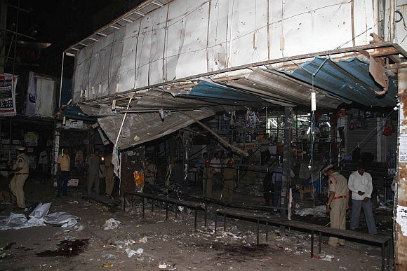 Police officials at the blast site in Hyderabad