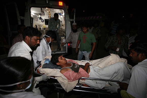 An injured person being loaded into an ambulance