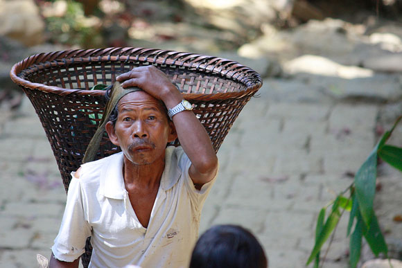 A villager with the traditional load carrying basket in the West Khasi Hills, Meghalaya