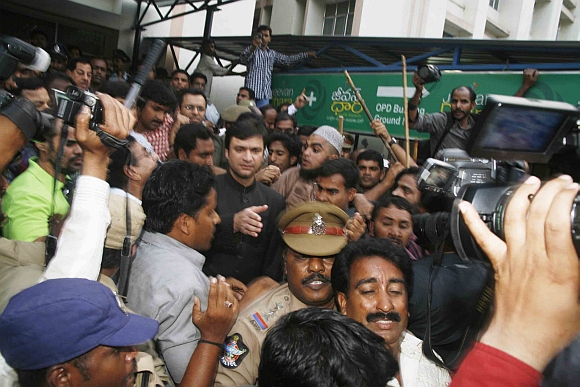 Majlis-e-Ittehadul Muslimeen MLA Akbaruddin Owaisi being taken into custody as his supporters raise slogans