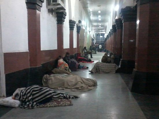 People sleeping on the floor at the Old Delhi railway station