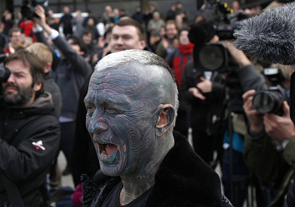 Vladimir Franz, university teacher, painter and composer who has tattoos covering 90 percent of his body arrives to a rally in Prague, after he collected more then 5,0000 supporting signatures which put him into the official race for the Czech Presidency