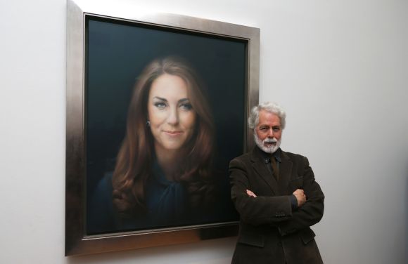 Glasgow-born artist Paul Emsley poses next to hisoil painting of Britain's Catherine, Duchess of Cambridge, the first commisioned portrait of her, at the National Portrait Gallery in central London