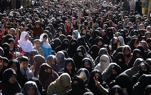 Women from the Shi'ite Hazara community gather to attend the funeral ceremony of victims who were killed by a bomb blast in Quetta