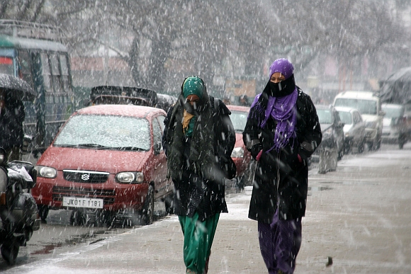 Kashmiri girls enjoying the snowfall