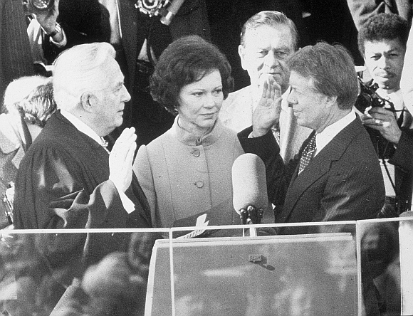 Jimmy Carter is sworn in by chief justice Earl Burger as the 39th president of the United States while first lady Rosalynn looks on, Washington DC