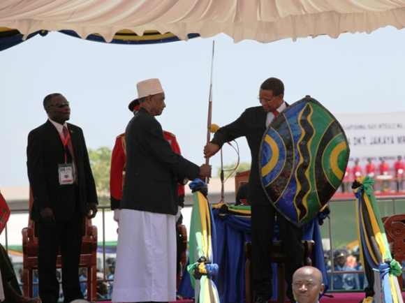 President of Tanzania Jakaya Kikwete receives a spear and shield during his swearing in