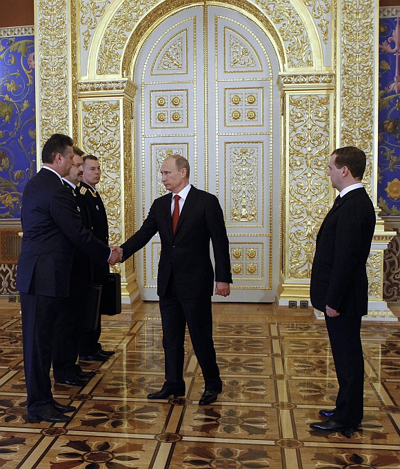 Russian President Vladimir Putin and former President Dmitry Medvedev take part in a ceremony to receive control of Russia's strategic nuclear forces after an inauguration ceremony at the Kremlin in Moscow