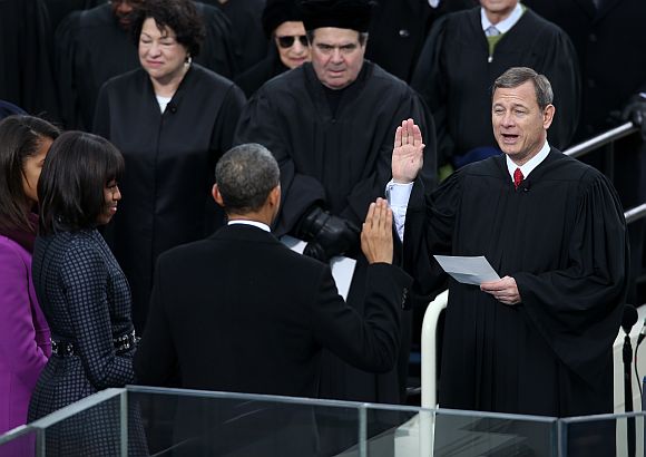 Barack Obama is sworn in by Supreme Court Chief Justice John Roberts