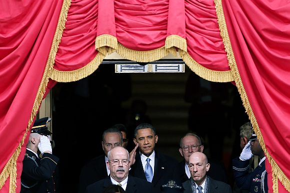 US President Barack Obama salutes as he arrives during the presidential inauguration