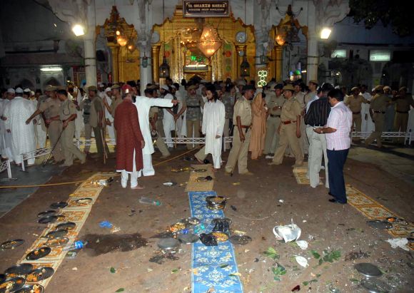 Security personnel and onlookers stand at the site of a bomb blast at the shrine of Sufi saint Khwaja Moinuddin Chisty in Ajmer in 2007