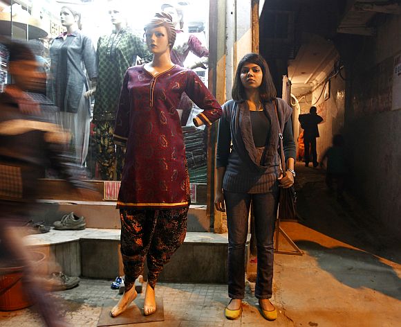 Richa poses next to a mannequin at a market in New Delhi