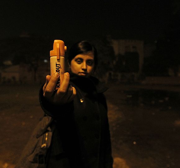 Shaswati Roy Chaoudhary, 23, who works for an online fashion company holds a bottle of pepper spray in a public park in New Delhi