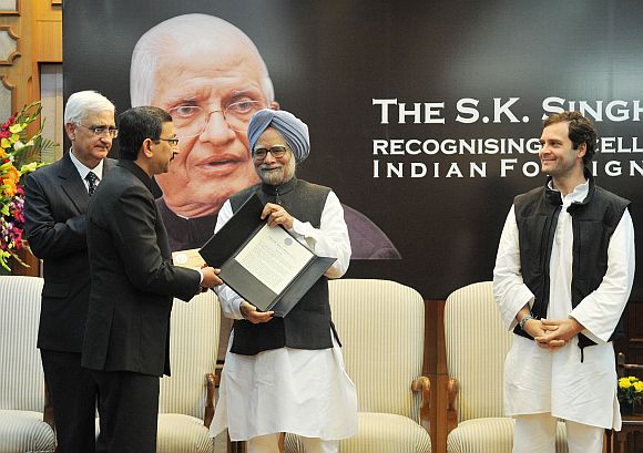 Dr Manmohan Singh presenting the S K Singh Award for recognising excellence in the Indian Foreign Service, to Tanmaya Lal. Also seen are External Affairs Minister Salman Khurshid and Congress Vice President Rahul Gandhi