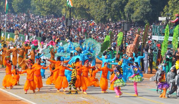 Schoolchildren perform at Rajpath during the 64th Republic Day parade in New Delhi