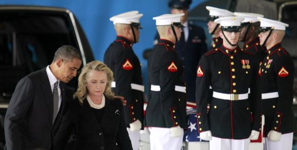 Barack Obama and Hillary Clinton participate in a transfer ceremony of the remains of US ambassador to Libya Chris Stevens and three other Americans killed in Benghazi, at Washington, DC