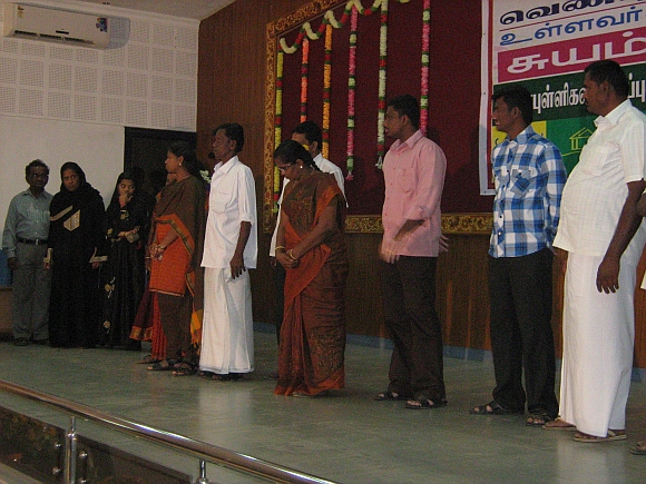 Participants present themselves on the stage