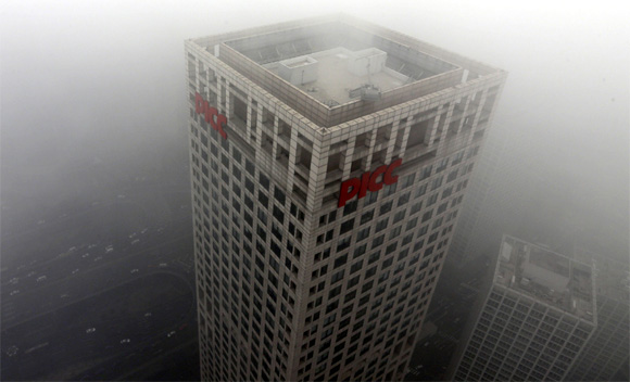 Buildings and cars are pictured in Beijing's central business district