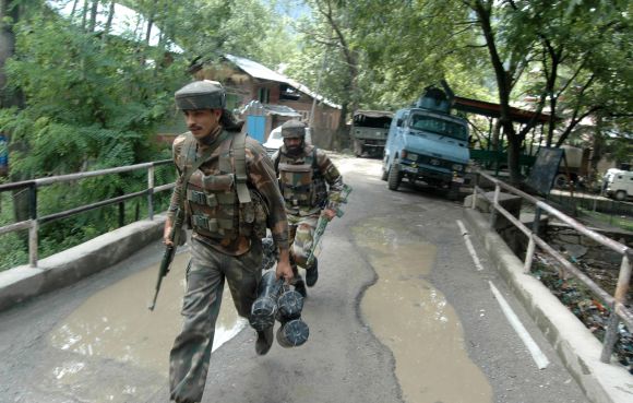 PIX: 3 militants, policeman killed in gunfight in Kashmir