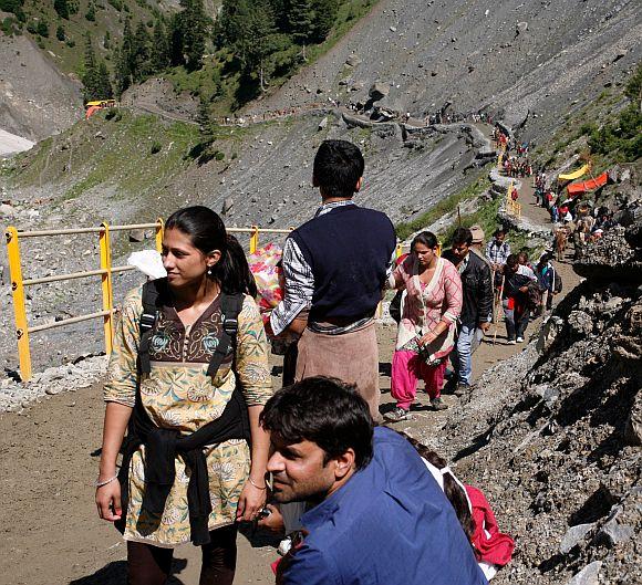 Pilgrims make a stop-over before continuing their journey to the cave shrine