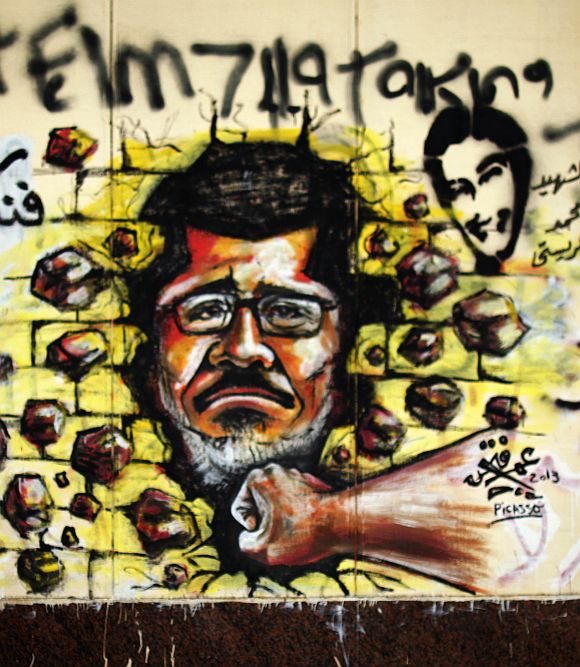 A graffiti depicting Egypt's President Mohamed Mursi on a wall of the Presidential Palace in Cairo