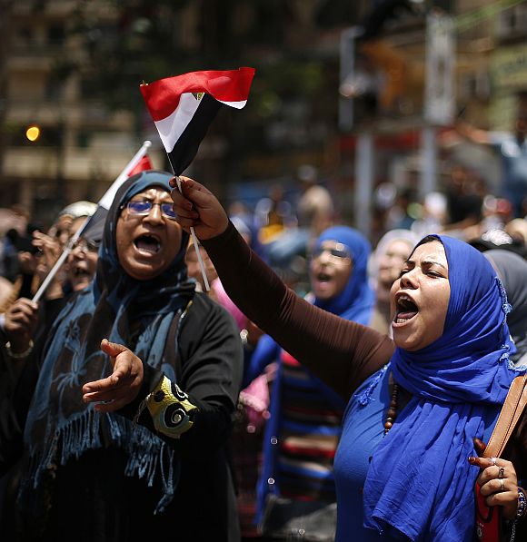 Protesters, opposing Egyptian President Mohamed Mursi, take part in a protest demanding Mursi to resign at Tahrir Square in Cairo