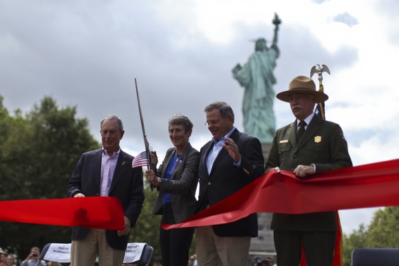 Secretary of the Interior Sally Jewell cuts the ribbon next to New York City Mayor Michael Bloomberg, US Senator Robert Menendez and Director of the United States National Park Service Jonathan B Jarvis at the reopening ceremony in New York
