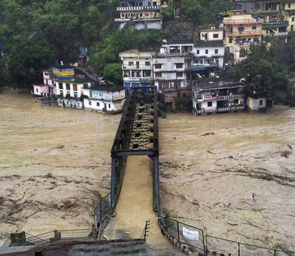 A bridge submerged in the flooded water of the river Ganga