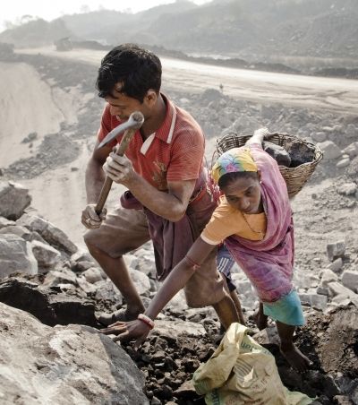 Local villagers scavenge coal illegally from an open-cast coal mine in the village of Jina Gora, Jharkhand. Photograph: Daniel Berehulak/Getty Images