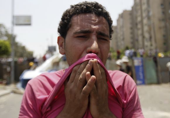 A member of Muslim Brotherhood reacts at Republican Guard headquarters in Nasr City
