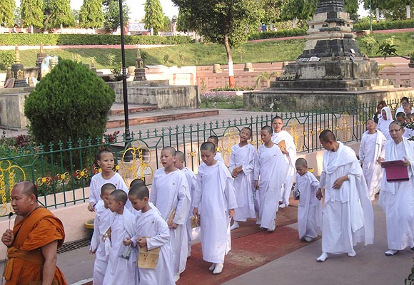 Child monks in white robes at the Mahabodhi temple in Bodh Gaya