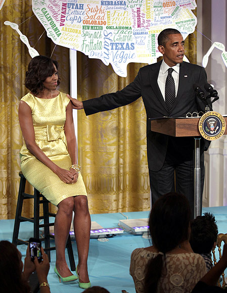 Obama addresses guests at the 'kids' state dinner', as wife Michelle watches on