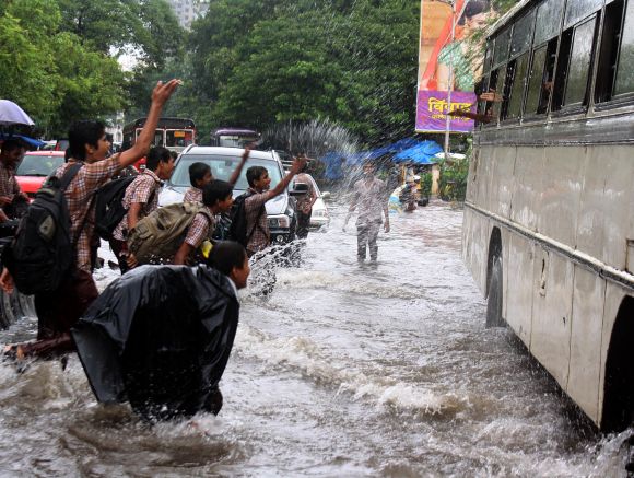 Mumbai slows down as rains hit road, rail traffic