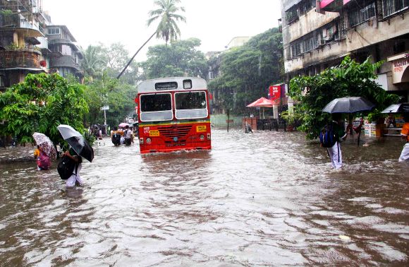 Mumbai slows down as rains hit road, rail traffic