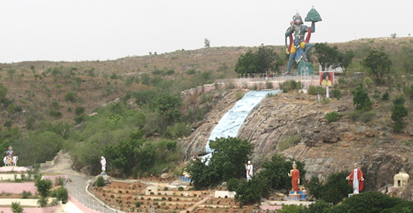 A hill in Prashanthi Nilayam with statues of Hanuman, Krishna, Shirdi Sai Baba, Shiva, Buddha, Christ, Zarathustra
