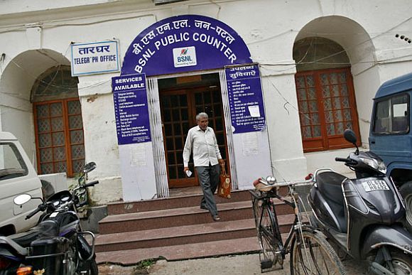 Messenger Om Dutt, 56, leaves the Central Telegraph Office to deliver telegrams in New Delhi